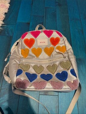 State rainbow heart backpack